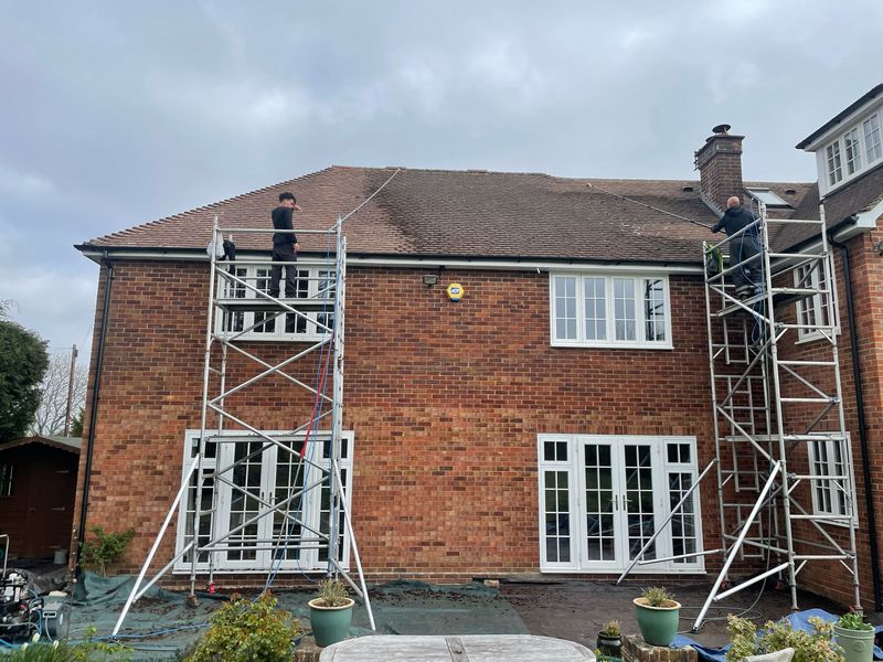 Roof cleaning carried out safely from scaffold towers by The Roof Moss Cleaners in Caterham